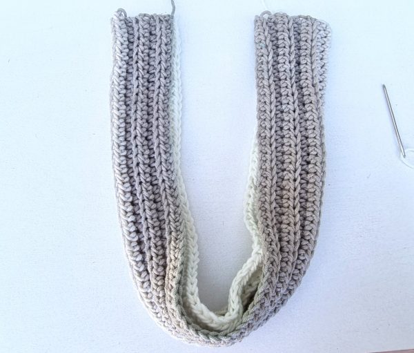 crocheted headband folded in half in U-shape