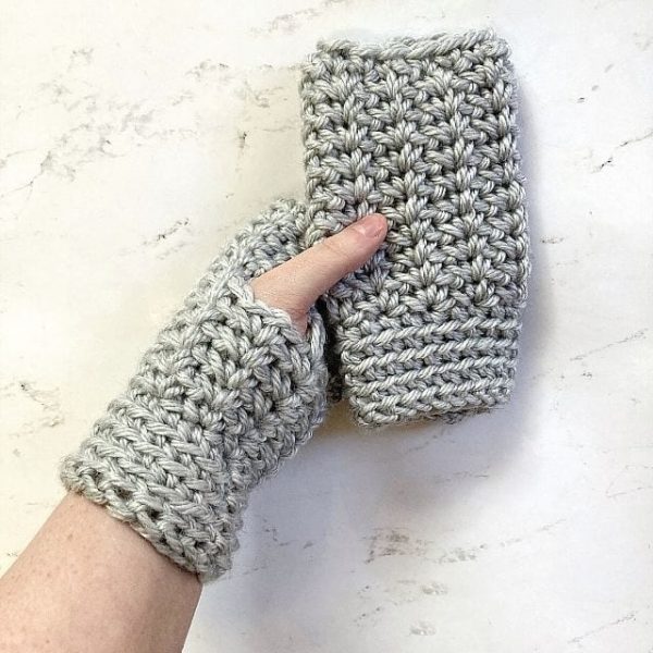 a pair of grey coloured fingerless gloves
