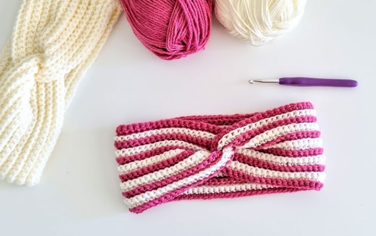 crochet twisted headband with red and white stripes on white background