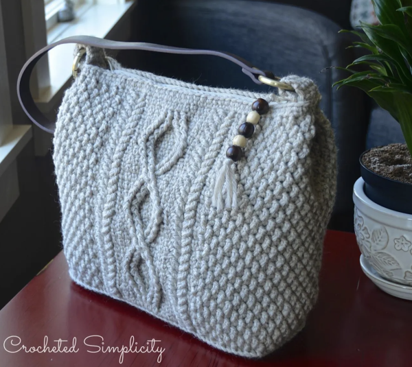 white crochet bag on a brown table