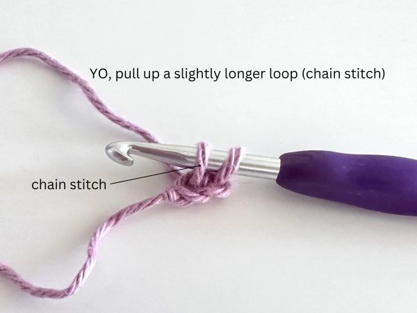 Two loops on hook, demonstrating the third step of the foundation single crochet stitch.