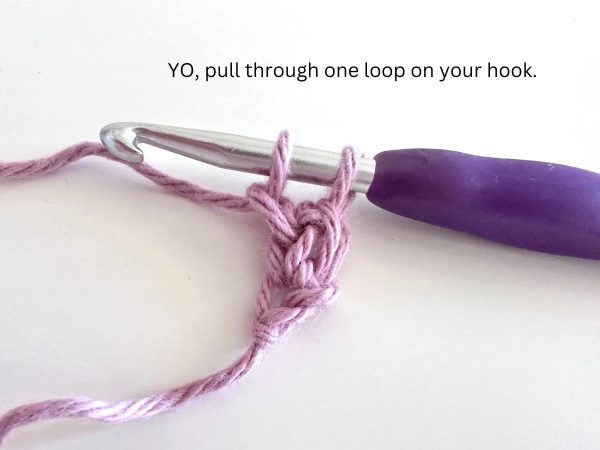 Two loops on hook, demonstrating the eighth step of the foundation single crochet stitch.