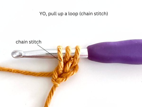 Three loops on a purple hook, illustrating the second step of the foundation half double crochet stitch